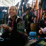 Giang Thi Mao, 14, holds on to one end of a friendship band as it is being pleated. Mao, from the Black Hmong tribe, spends her summer holidays with friends and foreigners visiting Sapa. -- CAROLINE CHIA/THE STRAITS TIMES 