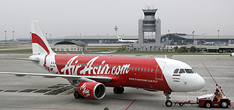 Malaysian low-cost carrier AirAsia said on Wednesday it will launch flights to Abu Dhabi in November, marking its first foray into the Middle East. --PHOTO: AP 