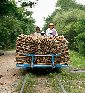 The bamboo rail transporting firewood in Cambodia. -- CAROLINE CHIA/THE STRAITS TIMES 
